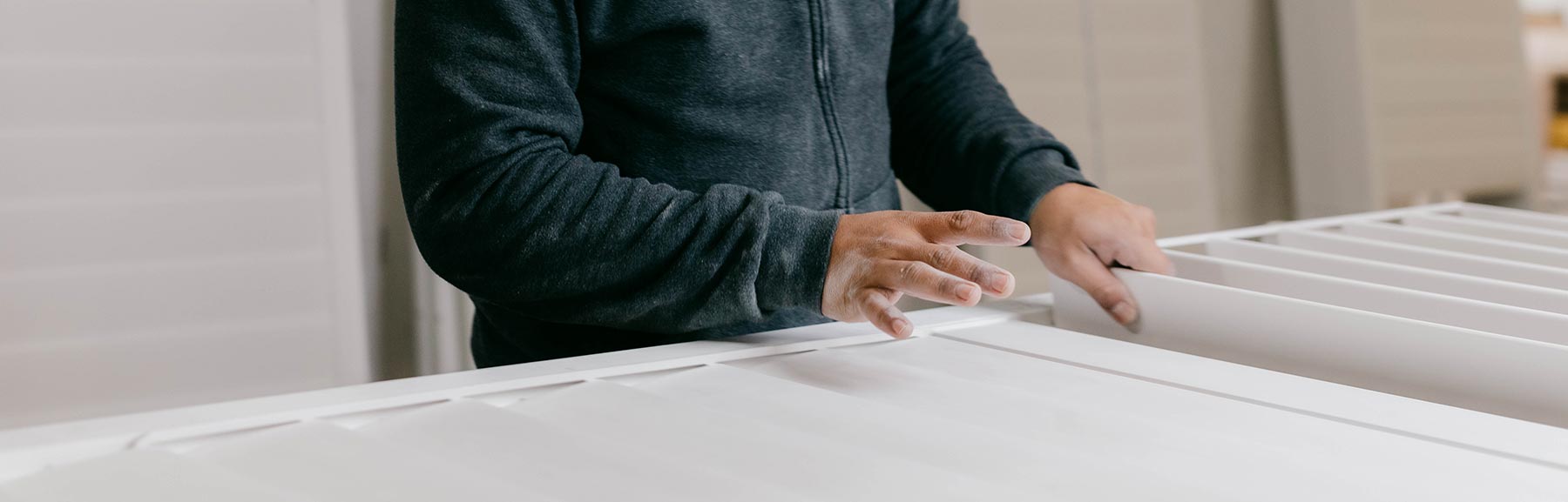 Quality inspecting finished blinds.